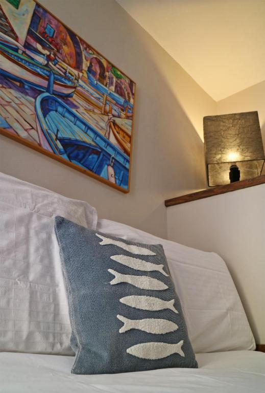 Postel nebo postele na pokoji v ubytování Allo Scalo Dei Mille