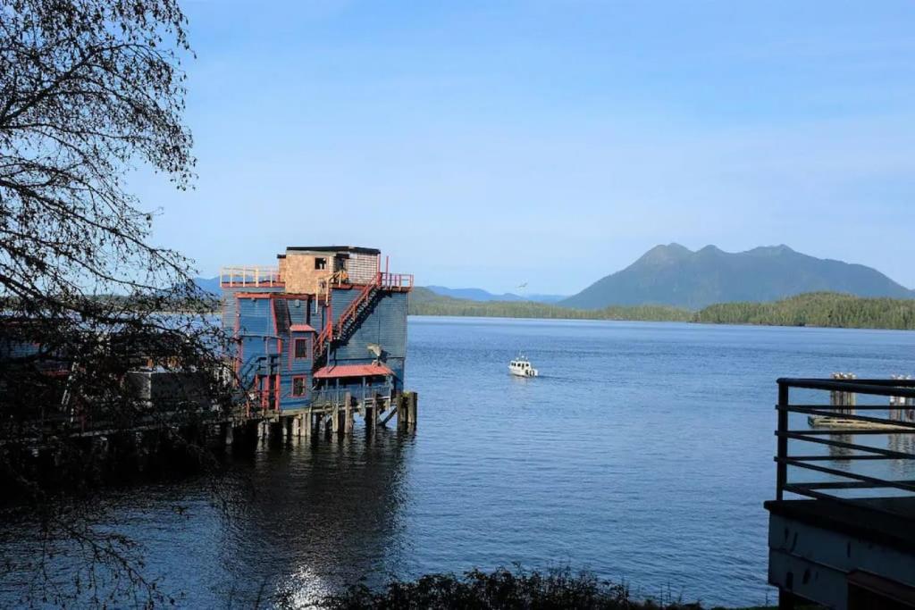 a boat is docked on a large body of water at Tofino Eco Waterfront Condo in Tofino