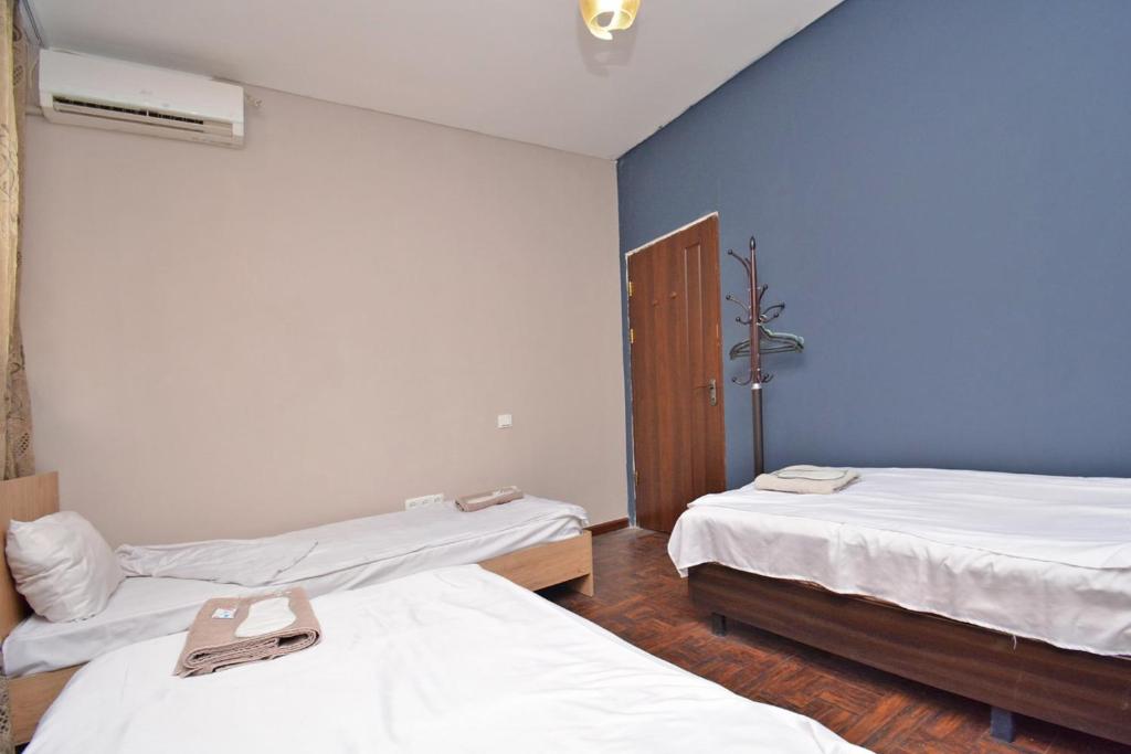 Postel nebo postele na pokoji v ubytování hotel Pushkin