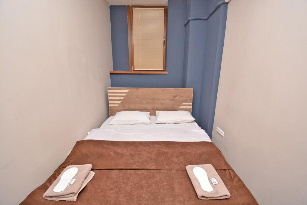 Postel nebo postele na pokoji v ubytování hotel Pushkin