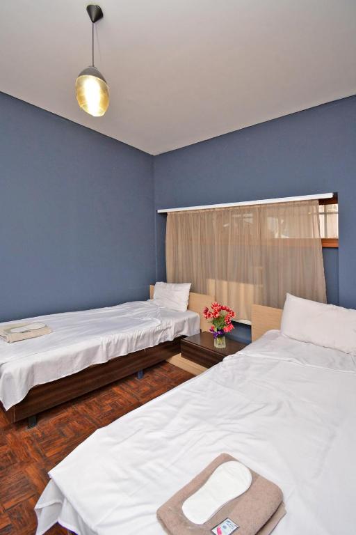 Postel nebo postele na pokoji v ubytování hotel Pushkin