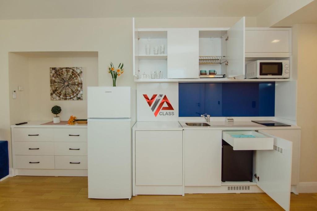 Kuchyň nebo kuchyňský kout v ubytování VIP CLASS ꙳ ORBI CITY