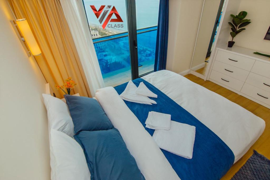 Postel nebo postele na pokoji v ubytování VIP CLASS ꙳ ORBI CITY