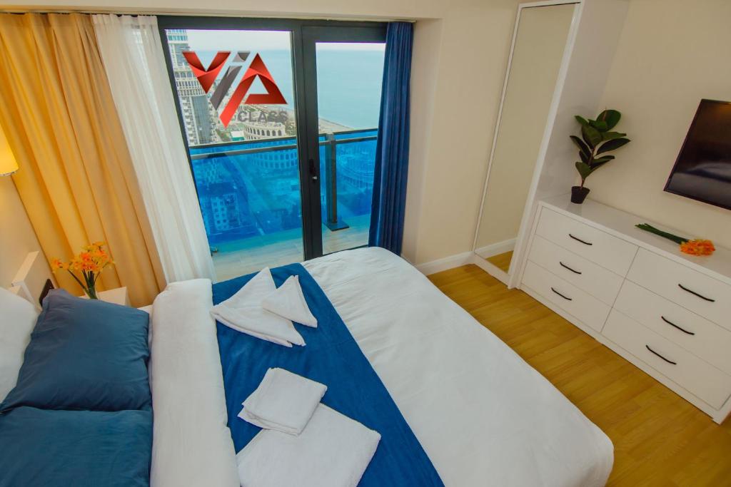 Postel nebo postele na pokoji v ubytování VIP CLASS ꙳ ORBI CITY
