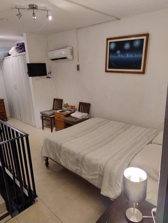 Postel nebo postele na pokoji v ubytování Bungalow Turrent, a 5 minutos de playa Mocambo