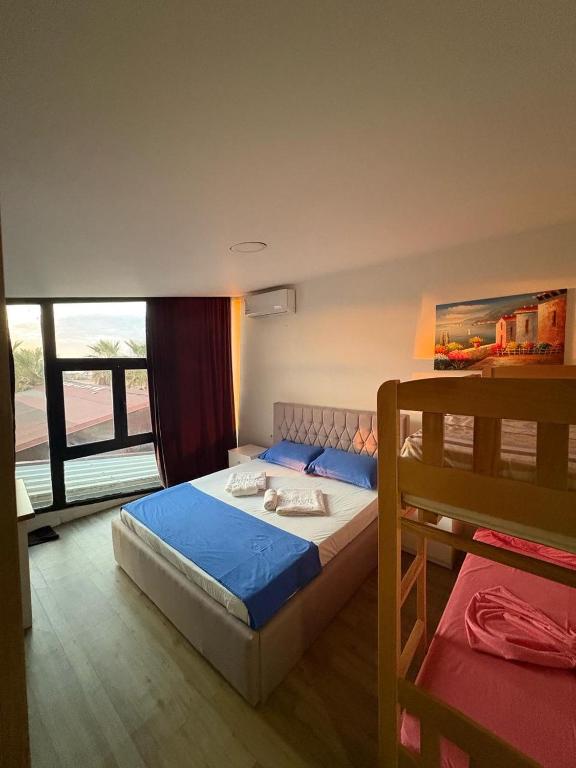 Postel nebo postele na pokoji v ubytování Saint Tropez Durres