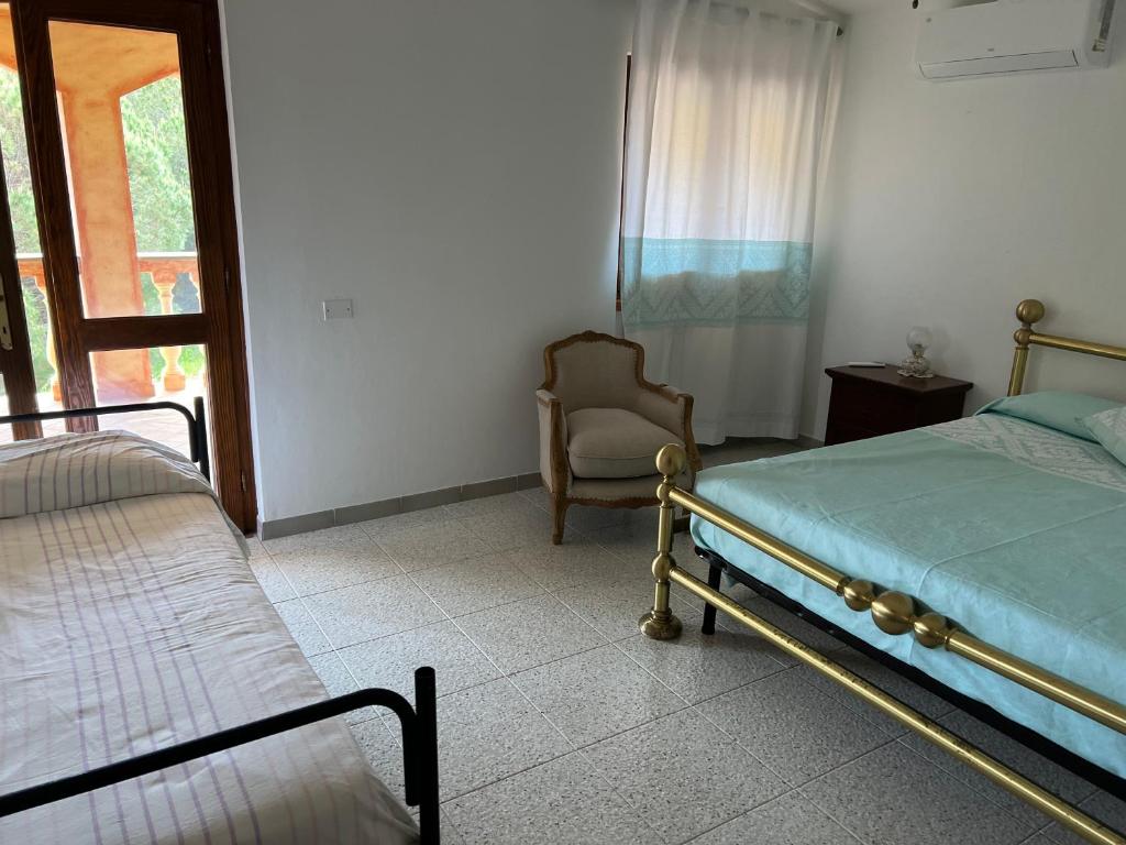 Postel nebo postele na pokoji v ubytování Casa Casteddina
