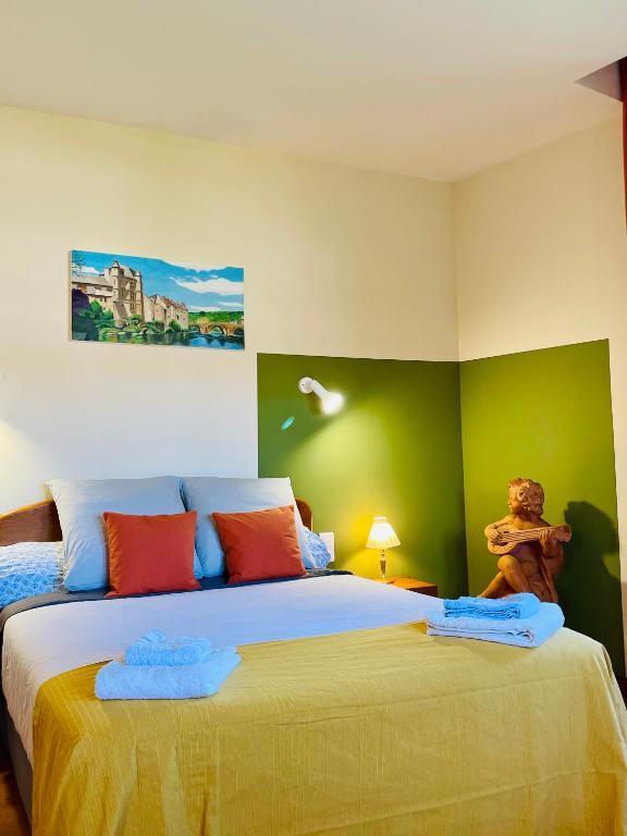 Postel nebo postele na pokoji v ubytování Appart'Hôtel - Au Vieux Palais