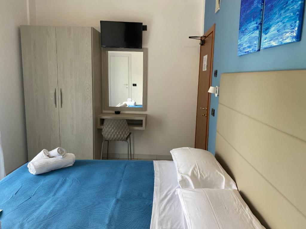 Postel nebo postele na pokoji v ubytování Hotel Stella Alpina