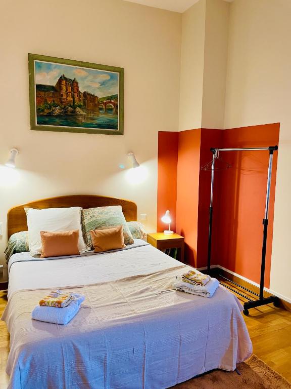 Postel nebo postele na pokoji v ubytování Appart'Hôtel - Au Vieux Palais