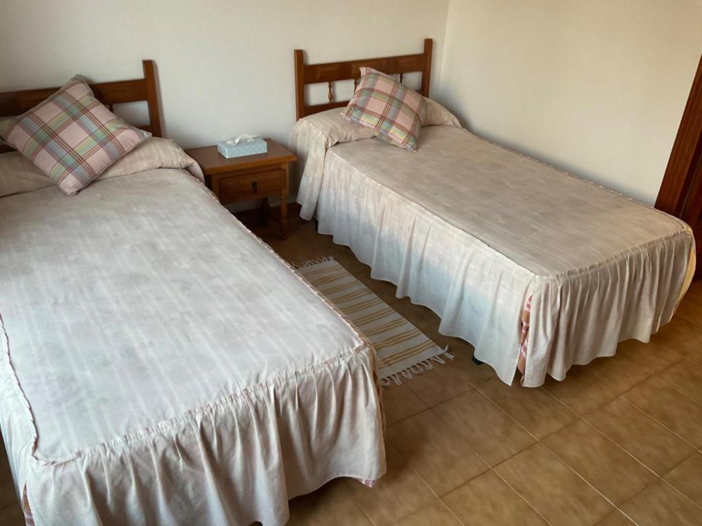 Postel nebo postele na pokoji v ubytování Adosado rustico familiar amplio