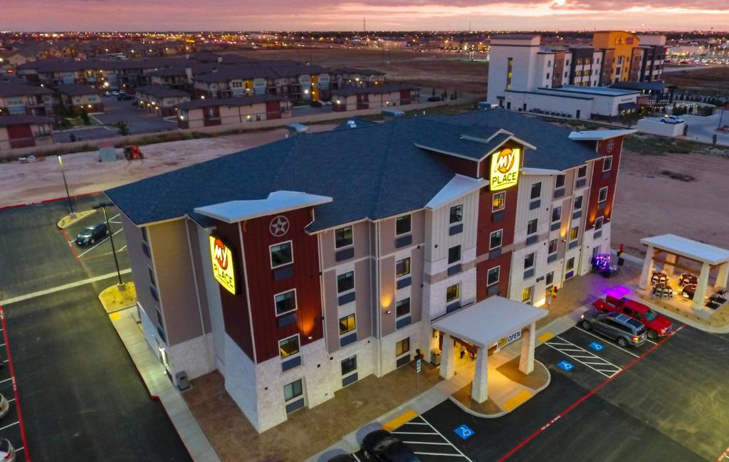 an overhead view of a hotel with neon signs on it at My Place Hotel-Lubbock, TX in Lubbock
