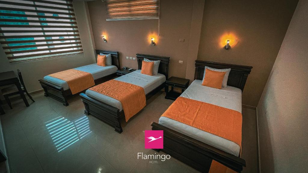 Postel nebo postele na pokoji v ubytování Hotel Flamingo