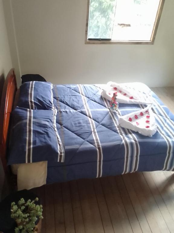 Postel nebo postele na pokoji v ubytování Rumi Wasi Hostel