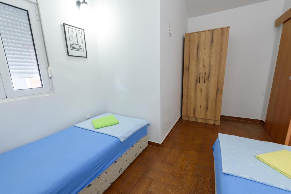 Postel nebo postele na pokoji v ubytování Vila Vujošević