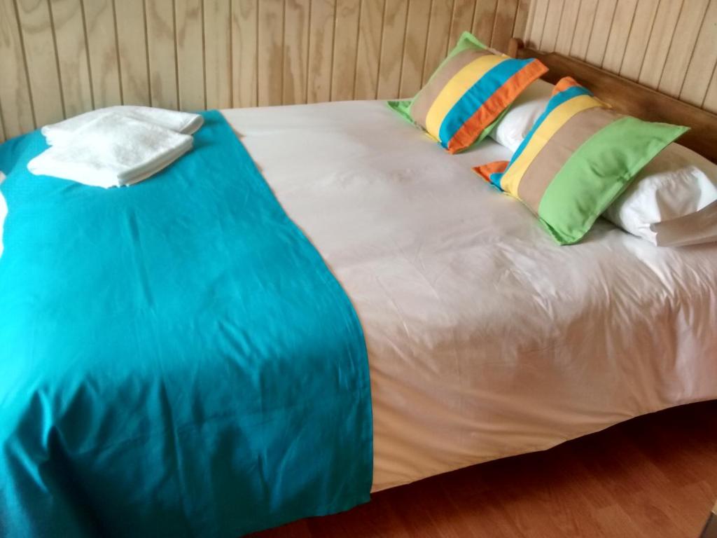 Postel nebo postele na pokoji v ubytování Cabañas Entre Parques