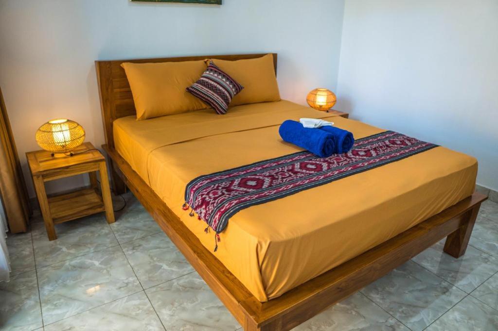 Giường trong phòng chung tại Pondok Satya