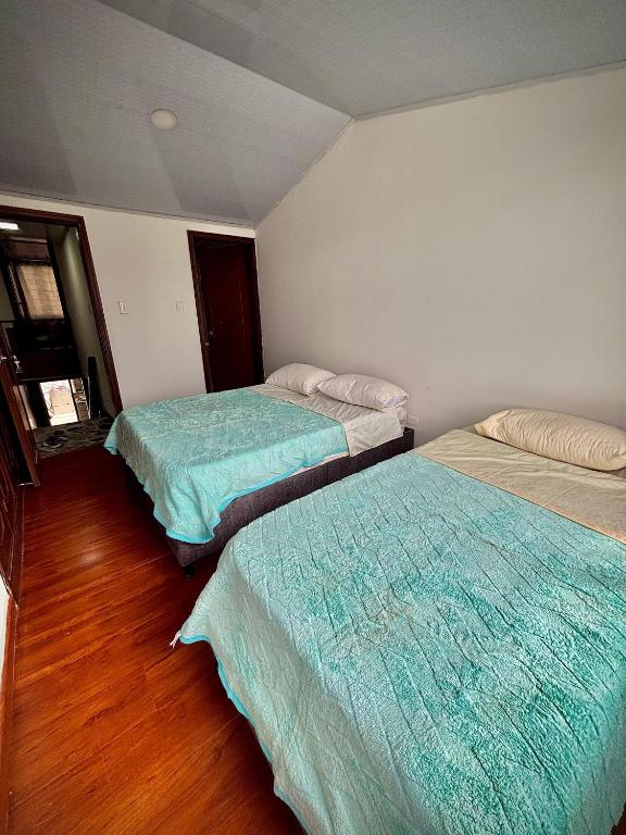 Postel nebo postele na pokoji v ubytování Kuyay Yachi Hostel