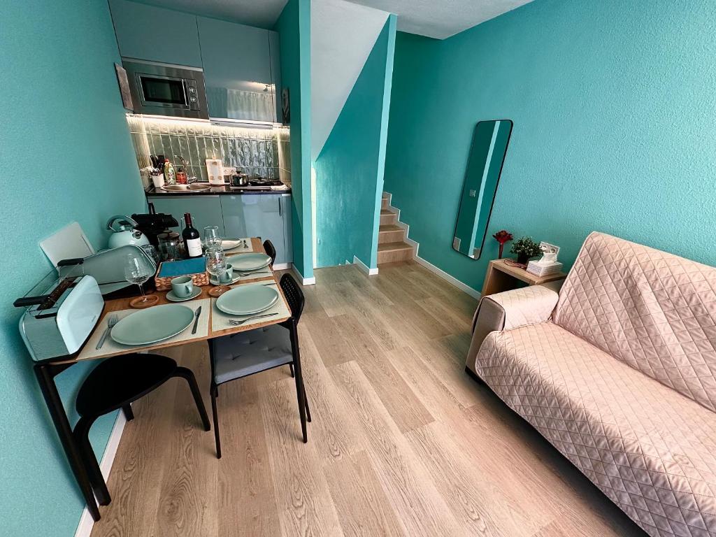 a living room with a table and a couch at Tiffany Lovely New Apartment 51 in Estepona