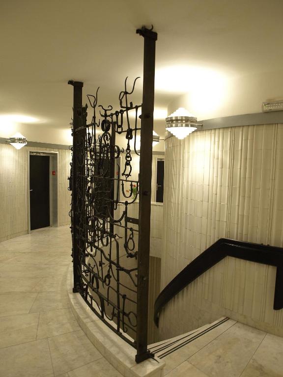 a metal gate in a hallway in a building at Hotel Ještěd in Liberec