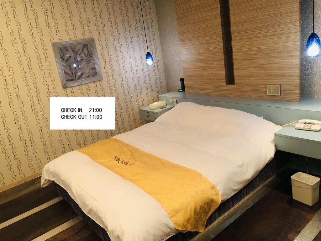 Кровать или кровати в номере ホテルヴィラコスタ Adult Only 男塾ホテルグループ