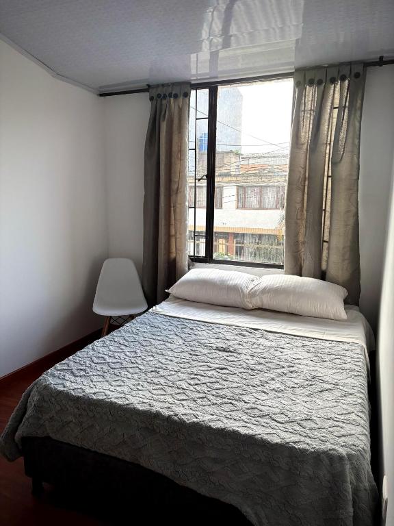 Postel nebo postele na pokoji v ubytování Kuyay Yachi Hostel