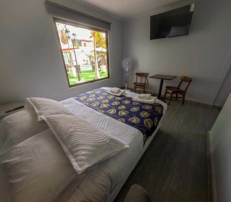 Postel nebo postele na pokoji v ubytování Hotel Divasto