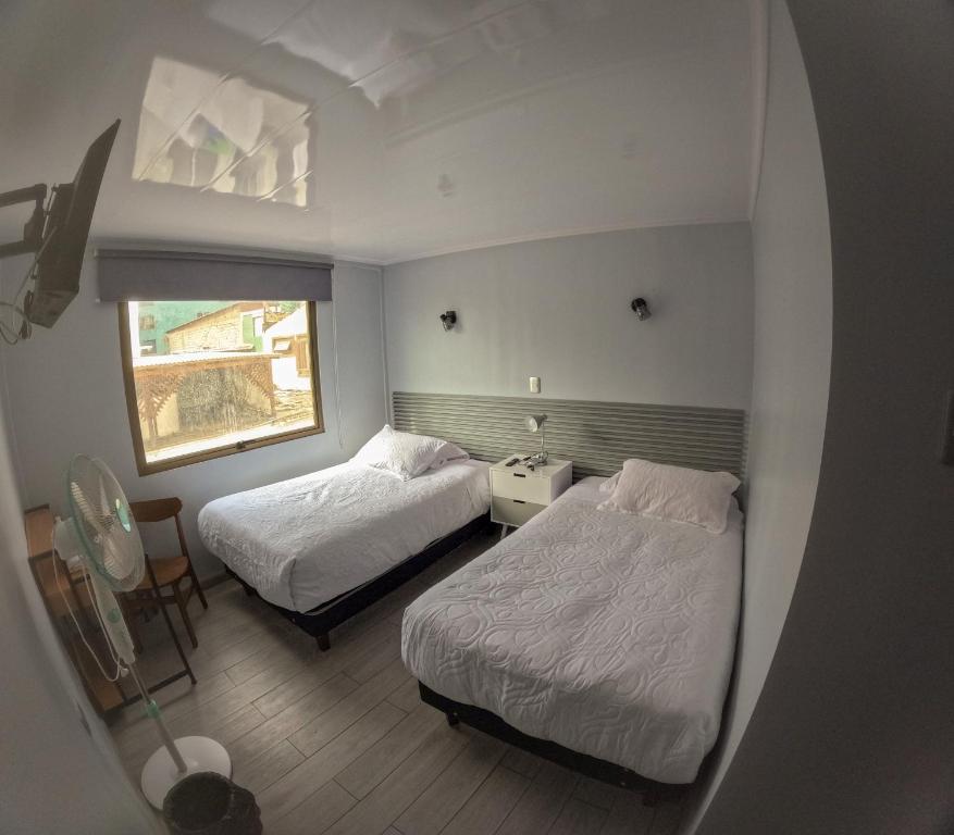 Postel nebo postele na pokoji v ubytování Hotel Divasto