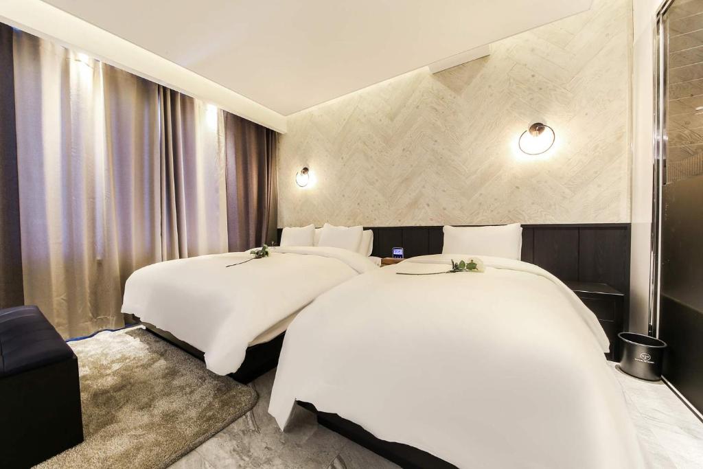 Postel nebo postele na pokoji v ubytování Hotel OSCAR