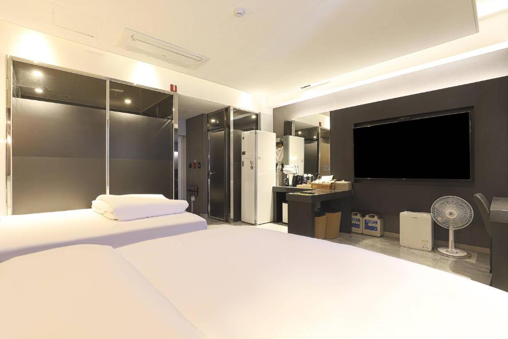 Postel nebo postele na pokoji v ubytování Hotel OSCAR