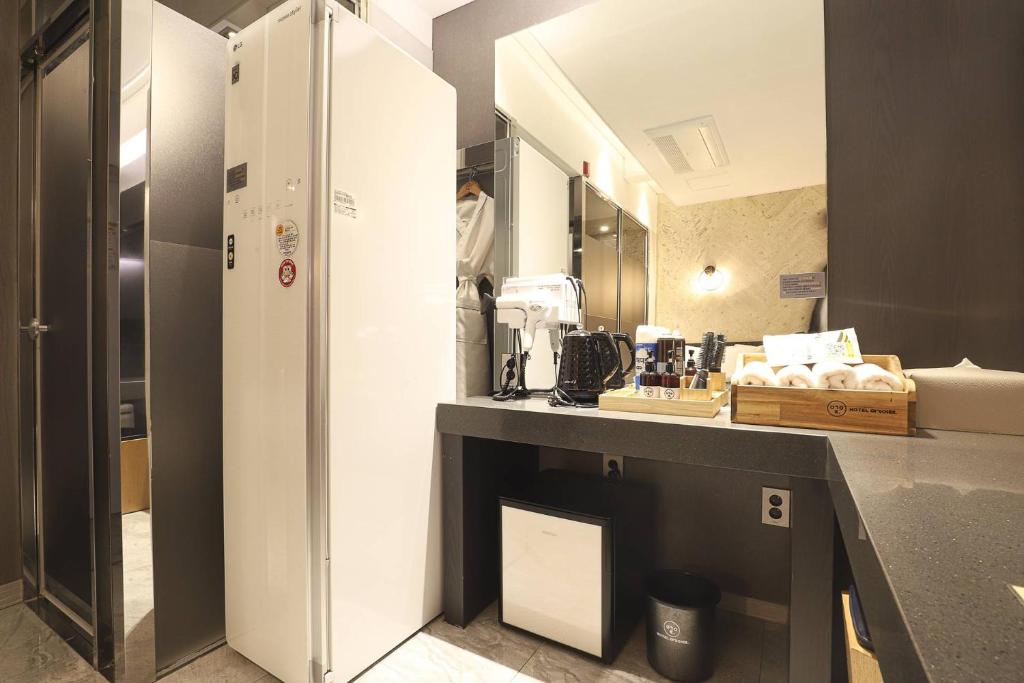 Kuchyň nebo kuchyňský kout v ubytování Hotel OSCAR