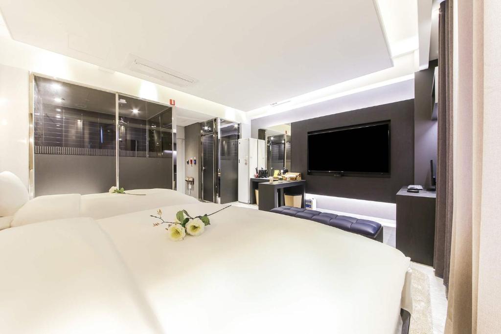 Postel nebo postele na pokoji v ubytování Hotel OSCAR