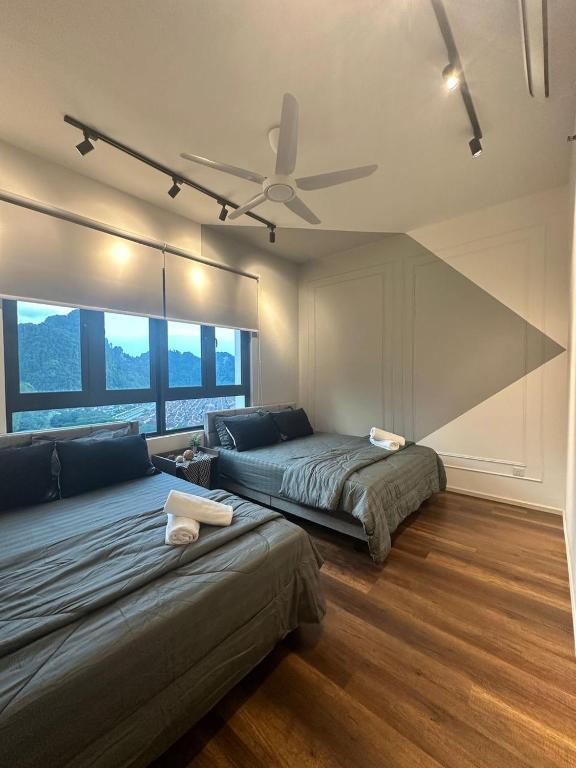 Postel nebo postele na pokoji v ubytování Sunway Onsen Suites