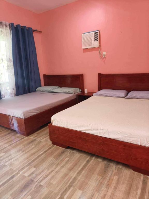 Voodi või voodid majutusasutuse Saki's inn toas