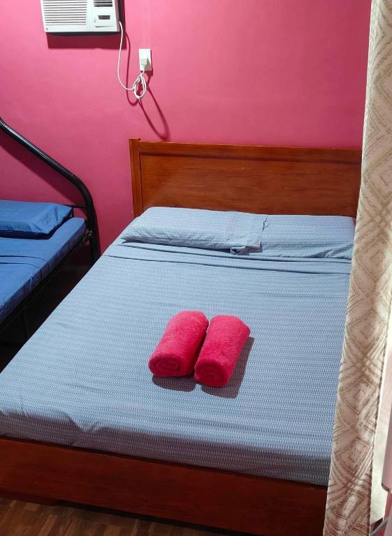 Voodi või voodid majutusasutuse Saki's inn toas