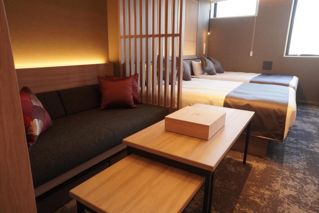 Postel nebo postele na pokoji v ubytování GRAND MONday GINZA