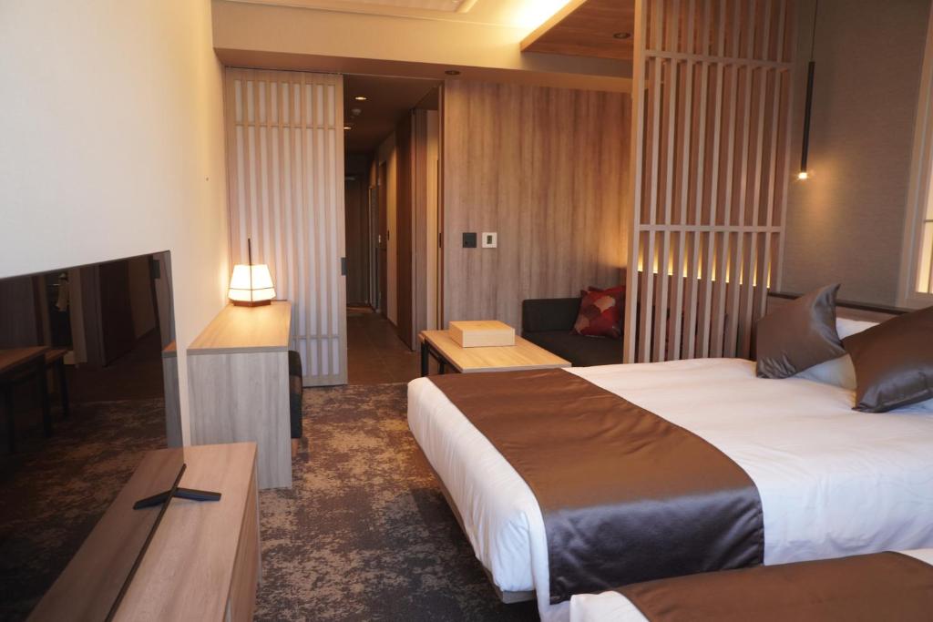 Postel nebo postele na pokoji v ubytování GRAND MONday GINZA
