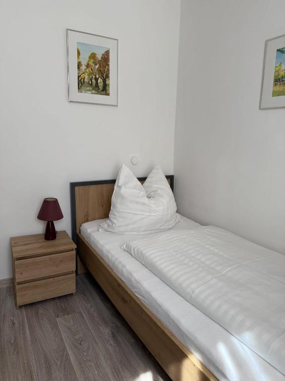 Postel nebo postele na pokoji v ubytování Hotel Weile