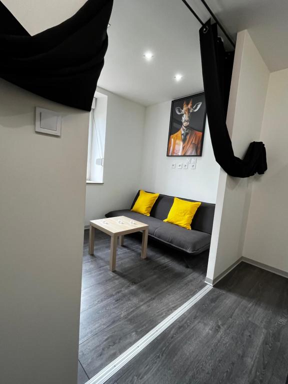 a living room with a couch and a table at KNUT-HOME Luxembourg in Knutange