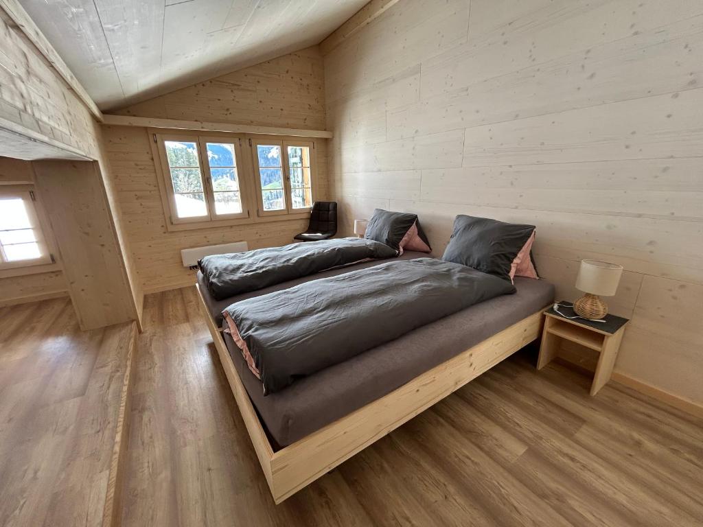Katil atau katil-katil dalam bilik di Alpenchalet Haldeli Ferienwohnung