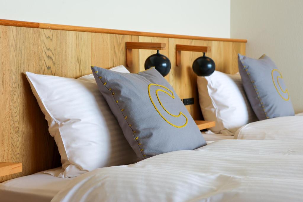 Postel nebo postele na pokoji v ubytování KAMOME SLOW HOTEL the COMPACT