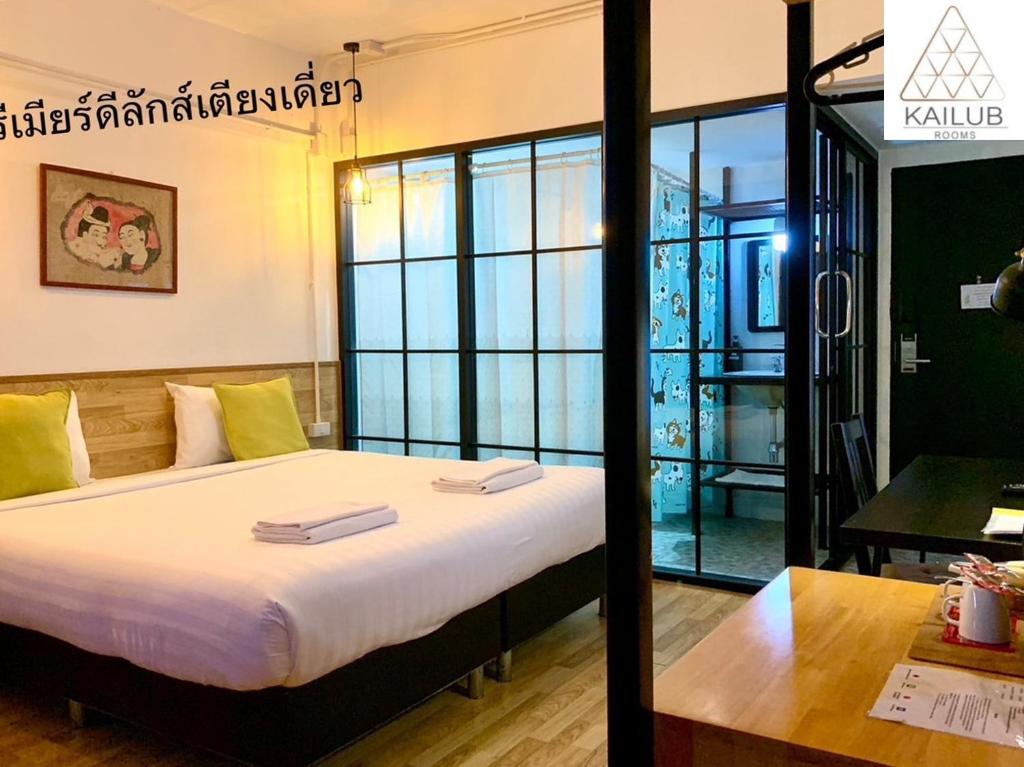 Postel nebo postele na pokoji v ubytování Kailub Rooms Hotel