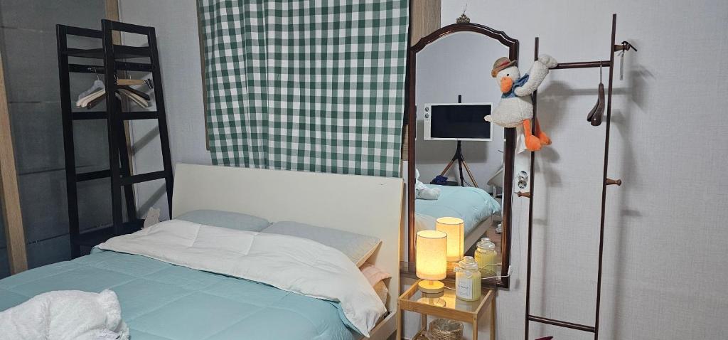 Postel nebo postele na pokoji v ubytování Bojeongdong 1room
