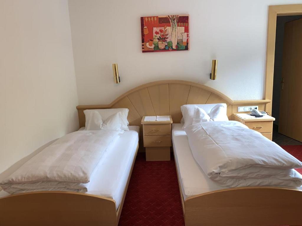 Postel nebo postele na pokoji v ubytování Hotel Sailer