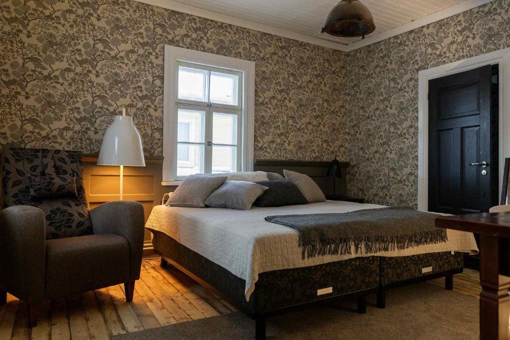 Ένα ή περισσότερα κρεβάτια σε δωμάτιο στο Finlandia Hotel Puu-Juuka