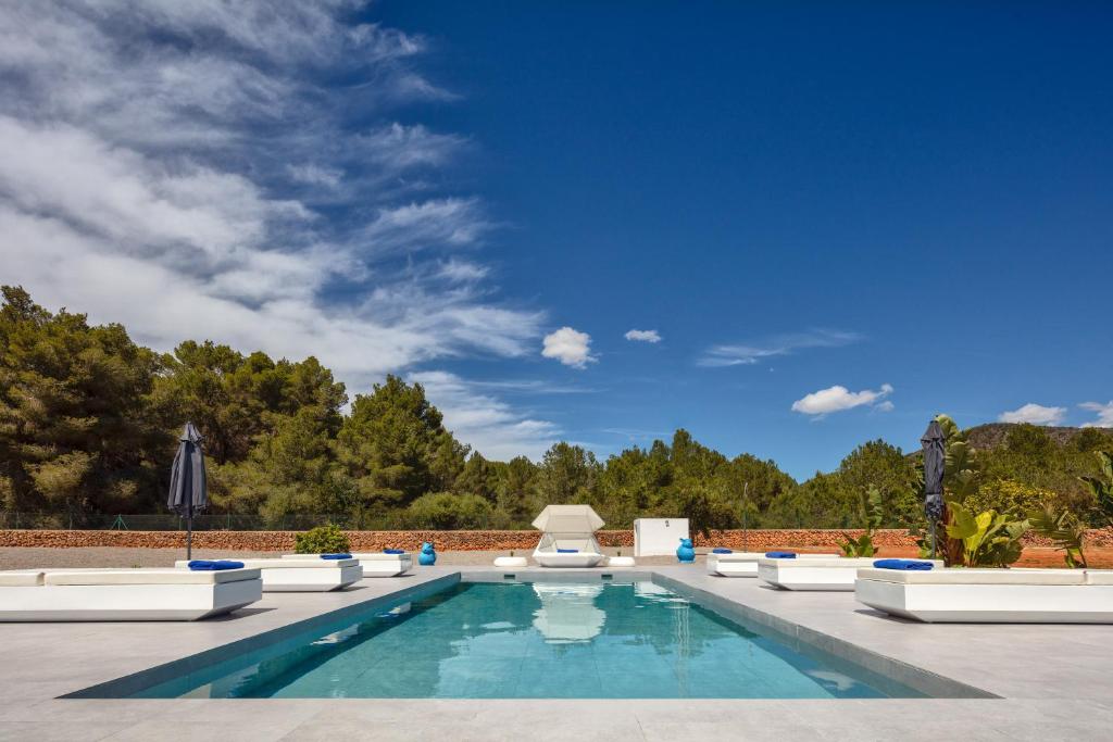a swimming pool in the middle of a yard at Villa Boutique Can Plana in Sant Jordi