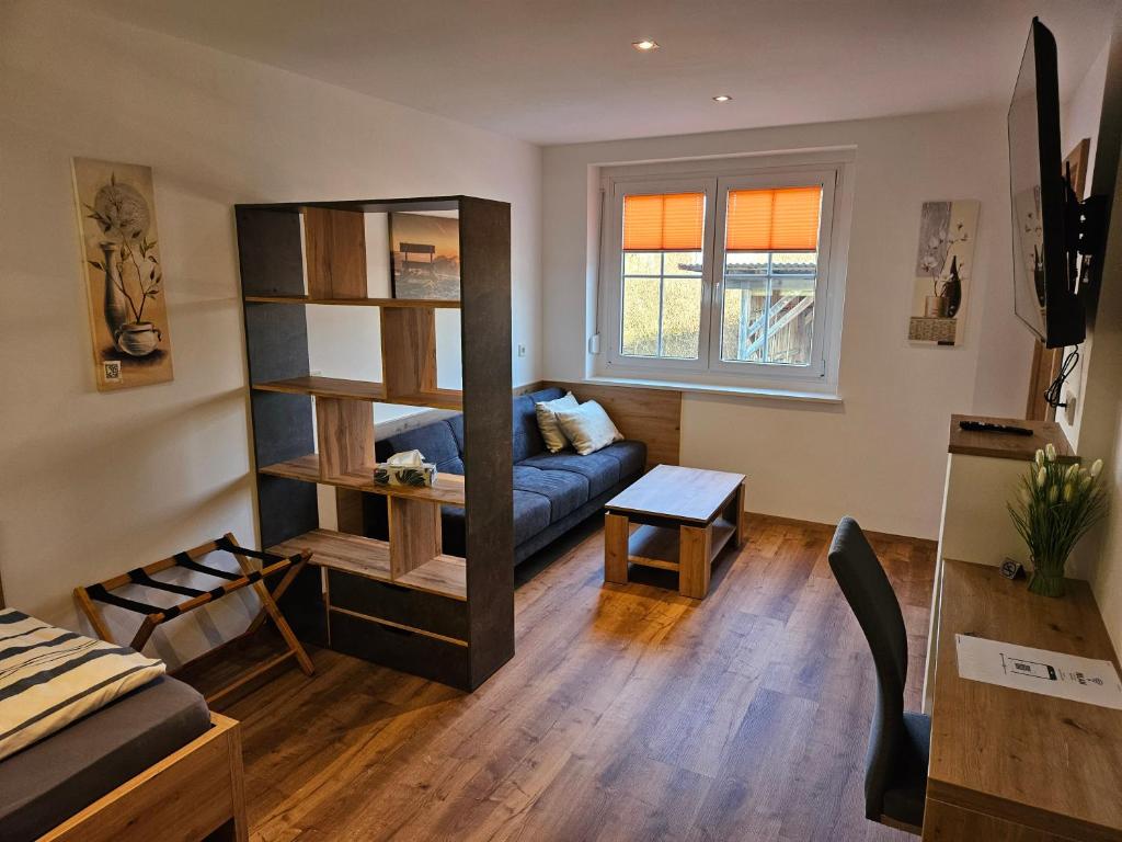TV a/nebo společenská místnost v ubytování Günthers Apartments