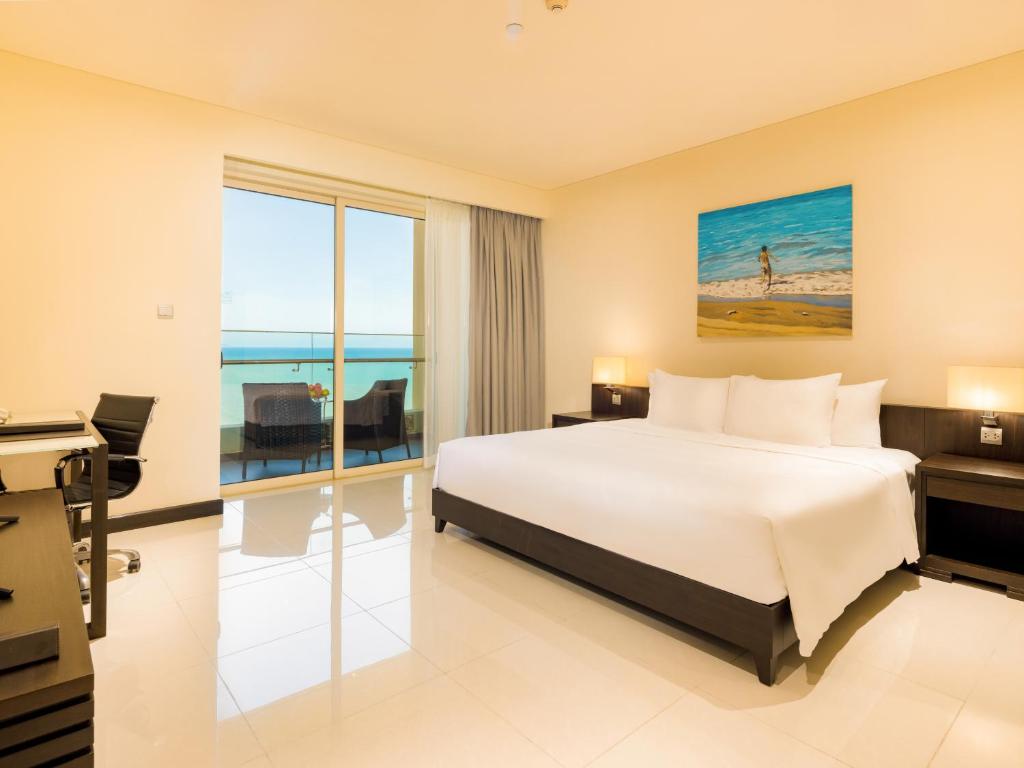 Postel nebo postele na pokoji v ubytování The Costa Nha Trang Residences