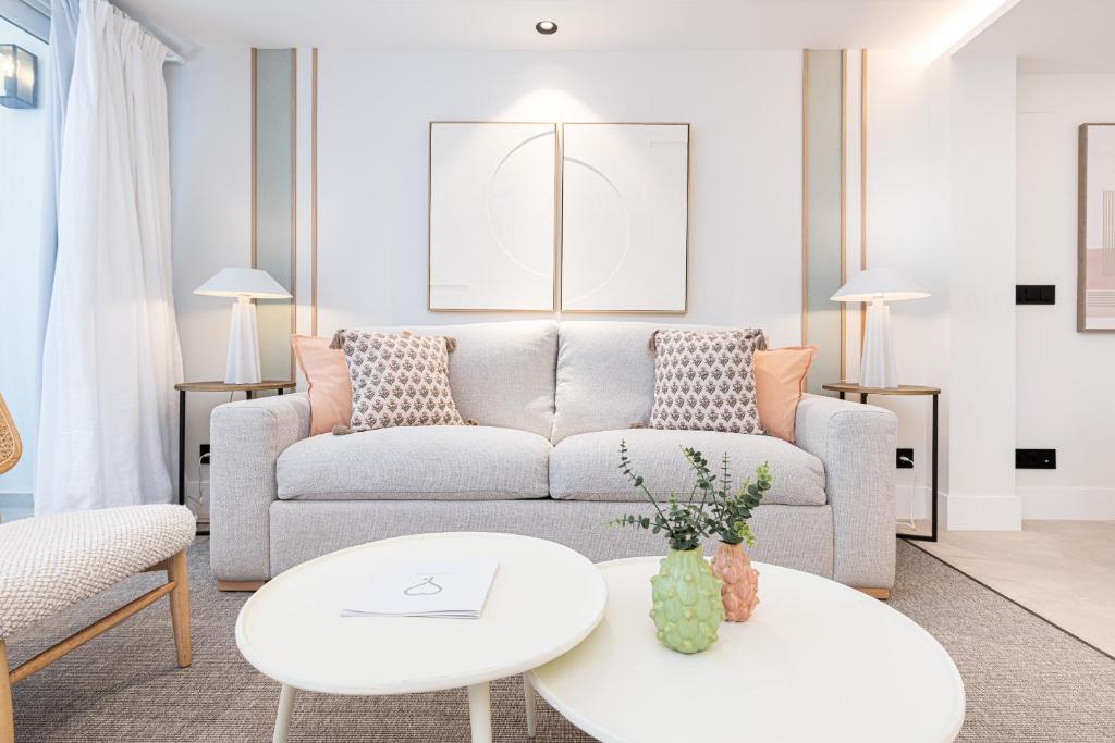 a living room with a couch and a table at iloftmalaga Puerto in Málaga