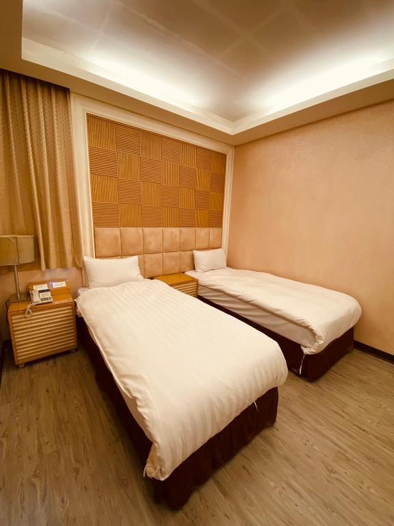 Postel nebo postele na pokoji v ubytování AOIKE Hot Spring Hotel